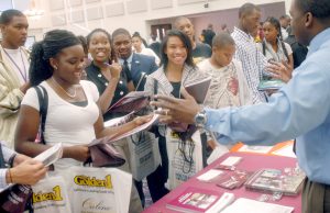 Local high school students speak with Sigmund Gilbreath a recruiter for Texas Southern University at the 2009 college fair at Mt. Calvary Baptist Church in Fairfield. The event featured representatives from more than 30 historically black colleges and universities. (Daily Republic file 2009)